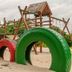 Ossanzaia Bilene Lodge in Bilene with colorful tire playground arches and wooden play structure