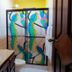 Arte Natura Boutique Hotel in La Fortuna bathroom with colorful stained-glass shower doors