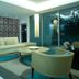 Silvershore Apartments on the Broadwater in Biggera Waters lounge with sofa, chairs and glass wall