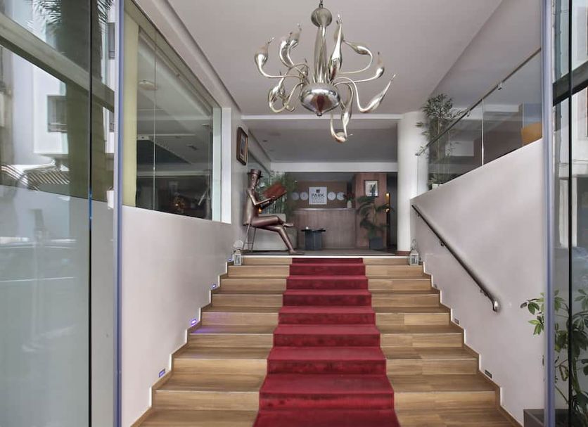 Park Suites Hotel Luxury Boutique Hotel in Casablanca stairway with red carpet runner and modern chandelier