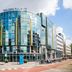 Golden Tulip Leiden Centre in Leiden, glass-front hotel exterior on a city street