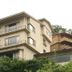 Kameya Ean in Izu, hillside hotel exterior with balconies and lush greenery