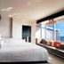 Hard Rock Hotel & Casino Biloxi room with ocean view, king bed and sofa by large windows