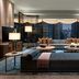 The St. Regis Hong Kong suite with city view, sofa seating, and floor-to-ceiling windows in Hong Kong