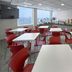 City Express Junior by Marriott Guadalajara Periférico Sur breakfast room with tables, red chairs and buffet
