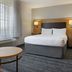 TownePlace Suites by Marriott Ontario Airport room with king bed, window light and TV in Rancho Cucamonga