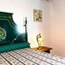 Monte das Palmeiras in Ferreira do Alentejo: ornate green bed with floral headboard in guest room