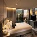 Dorsett Gold Coast guest room with city skyline views through floor-to-ceiling windows in Broadbeach