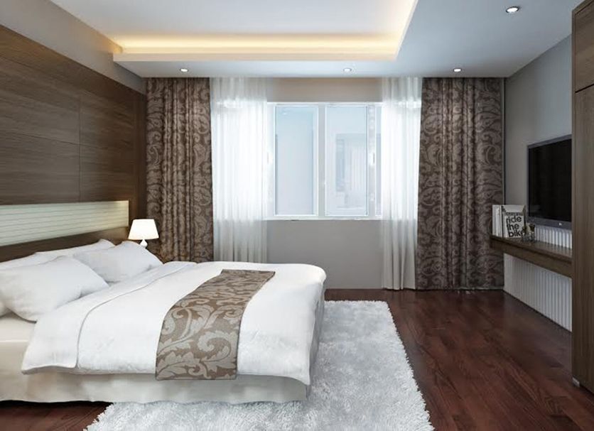 Eco Luxury Hotel Hanoi room with king bed, city-view window, TV, and wood flooring in Hanoi