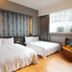 Military 75 Hotel in Taichung City twin room with two beds and large frosted window