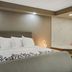 Red Roof Inn & Conference Center Chicago - Aurora Fox Valley guest room with king bed and bathtub