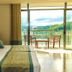 Oak Ray Heritage Hotel in Kandy room with bed and balcony overlooking hills