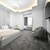 Imperial Palace Hotel Yerevan guest room with king bed, sitting area and gray carpet