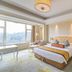 Dongjiao State Guesthouse Nanjing bedroom with king bed, large windows and scenic mountain view