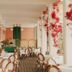 Hotel Del Golfo in Finale Ligure: elegant terrace dining area with rattan chairs and red flowers