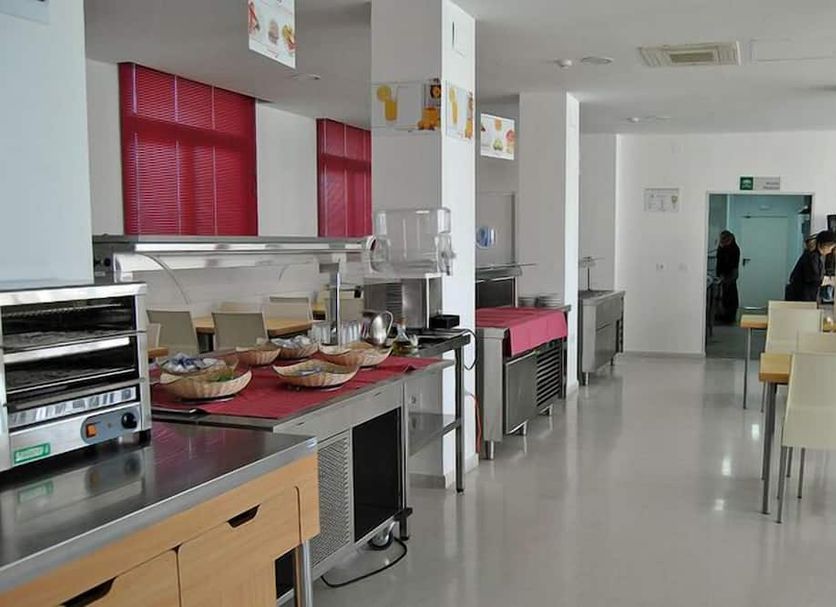 Albergue Inturjoven Jerez De La Frontera dining room with buffet counter and tables in Jerez de la Frontera