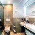 Four Points by Sheraton Offenbach Plaza bathroom with walk-in shower, toilet and vanity in Offenbach am Main