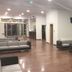 Grand Hotel Lamezia lobby in Lamezia Terme with polished floors, seating areas and wall-mounted TVs
