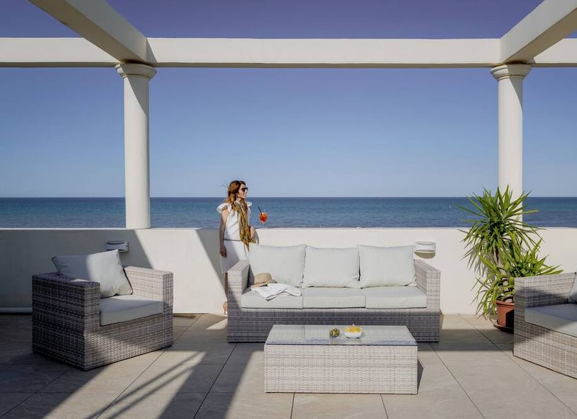 Hotel Riviera in Milano Marittima terrace seating with ocean view and lounge chairs