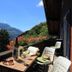 Long & Short Stay Hotel Bahnhof Ausserberg balcony with table, chairs and mountain valley view in Ausserberg