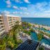 Waldorf Astoria Riviera Maya in Cancún with oceanfront pool, palm trees and beach views