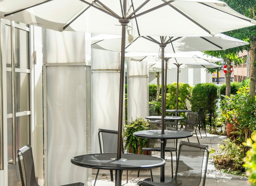 Hotel Jal City Kannai Yokohama patio seating with umbrellas and greenery in Yokohama