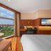 Novotel Zhengzhou Convention Centre room with city view, desk by window, and large floor-to-ceiling windows