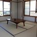 Minshuku Hayashi in Kamogawa tatami room with low table and windows