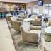 Residence Inn by Marriott Akron South/Green lobby seating area with lounge chairs and large windows