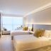 The Bauhinia Hotel - Central, Hong Kong: modern twin beds with large window and city view