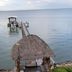 Come Friday Cottages on the Bay in Bacliff: thatched gazebo deck with bay pier and calm water