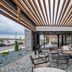Courtyard by Marriott Toledo West outdoor patio with lounge seating and slatted pergola in Toledo