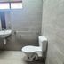 Hospitality Kalgoorlie bathroom with sink, toilet, and tiled walls in Kalgoorlie