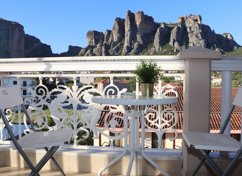 Hotel Kosta Famissi in Kalabaka balcony with mountain rock formations and town rooftops view