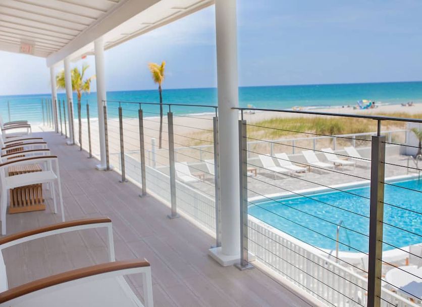 Tides Inn Hotel in Lauderdale-by-the-Sea with oceanfront balcony and pool view
