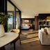Mercure Kangaroo Island Lodge in Kingscote: open-plan suite with sofa, dining area and bedroom view