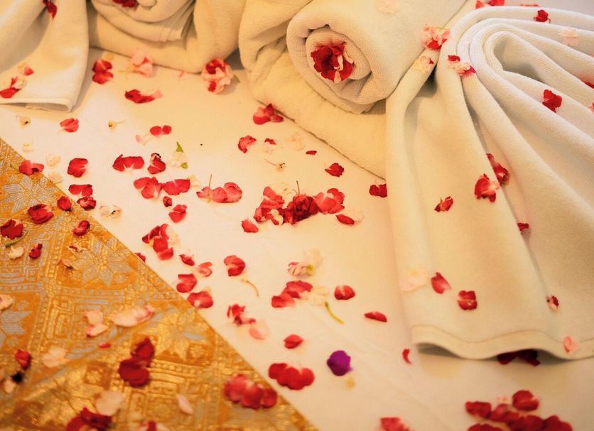 Yunna Hotel, Bandar Lampung bed decorated with towel swans and rose petals
