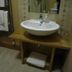 Station Hotel And Restaurant Melrose bathroom with white basin sink on wooden vanity