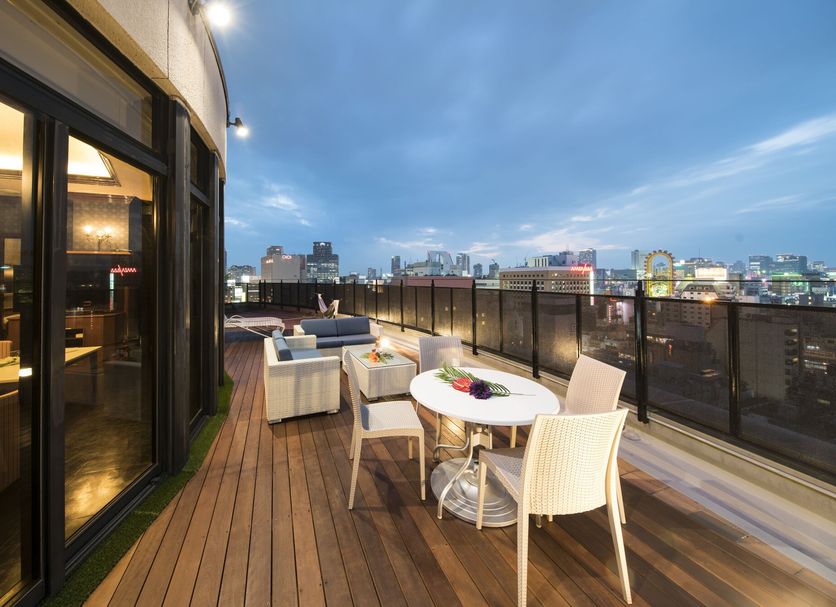Hotel Alps Osaka rooftop terrace with city skyline view and outdoor seating