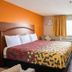 Express Inn & Suites San Antonio Near Sea World Medical Center room with king bed, desk and window