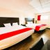 Oyo Hotel San Antonio Lackland AFB/Seaworld Hwy 90 W room with two beds and red bed runners