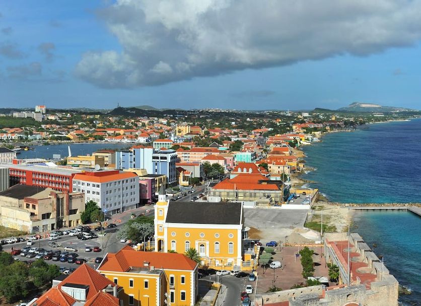 Majestic City Suites & Beach Hotel in Willemstad with colorful waterfront city and ocean view