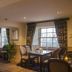 The Inn at Kippen, Stirling dining room with tables, chairs, candles and large windows