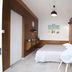 Hotel Rachel, Le Pré-Saint-Gervais: modern guest room with bed, chair and wood-paneled walls
