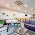 B&B HOTEL Maubeuge-Louvroil lounge with purple seating and buffet dining area in Louvroil