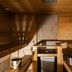 Original Sokos Hotel Vaakuna Joensuu sauna with wooden benches and a small cooler in Joensuu