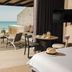 Arennas Mancora in Máncora: oceanfront suite patio with plunge pool, dining table and beach view