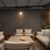 WorldHotel Casati 18 in Milan: stylish outdoor lounge with beige sofas, low table and wall lighting
