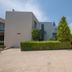 Electra Holiday Village Water Park Resort in Ayia Napa with modern low-rise buildings and landscaped hedges