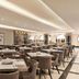 Ramada by Wyndham Mekkah Al Tayseer in Mecca, spacious hotel dining room with neatly set tables